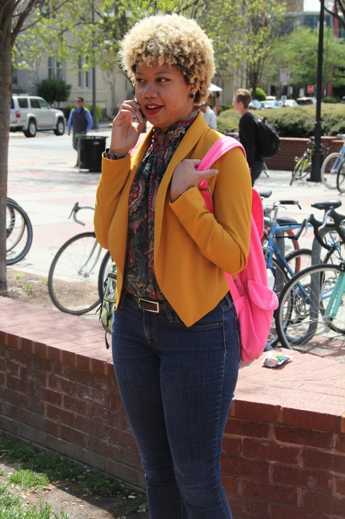Indica Webb, Philosophy major, wearing a thrifted top, Mine jacket, and Levi jeans.